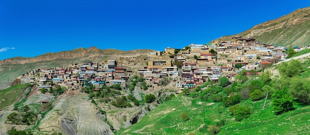 Panorama of the entire ancient mountain village Chokh on a rocky slope in Dagestan