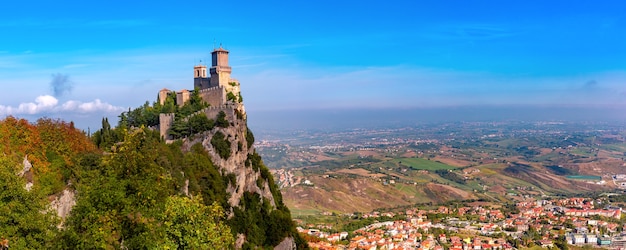 Panorama of First tower Guaita fortress in the city of San Marino of the Republic of San Marino and italian hills in sunny day