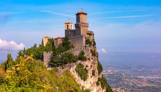 Panorama of First tower Guaita fortress in the city of San Marino of the Republic of San Marino and italian hills in sunny day