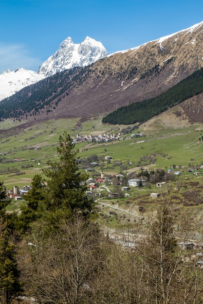 panorama of Georgian road mountains village and snow