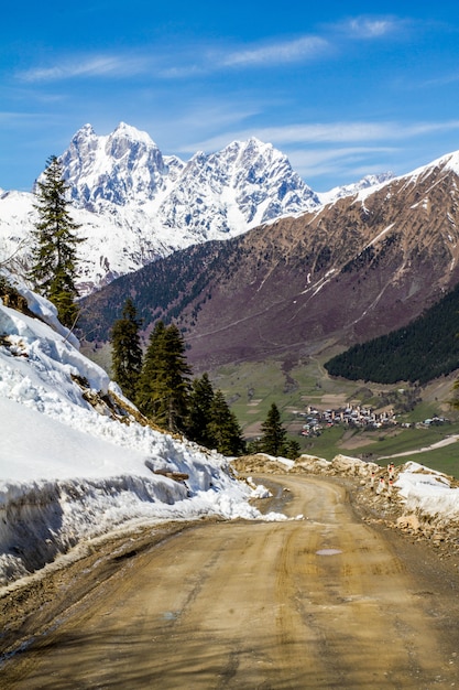 panorama of Georgian road mountains village and snow