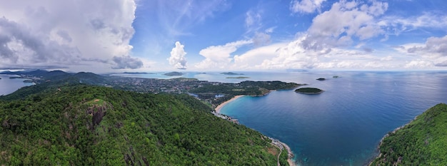 Panorama landscape mountains nature view from Drone camera Aerial view of mountain and seashore in phuket thailand Beautiful sea in summer sunny day time