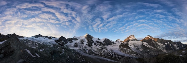 Panorama of a mountain ridge with Ober Gabelhorn and Dent Blanche peaks of Swiss Alps