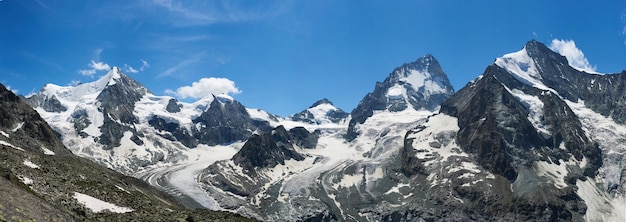 Panorama of a mountain ridge with Ober Gabelhorn and Dent Blanche peaks of Swiss Alps