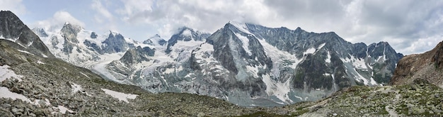 Panorama of a mountain ridge with Ober Gabelhorn and Dent Blanche peaks of Swiss Alps