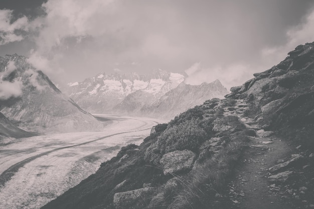 Panorama of mountains scene, walk through the great Aletsch Glacier, route Aletsch Panoramaweg in national park Switzerland, Europe. Summer landscape, sunshine weather, blue sky and sunny day