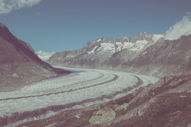 Panorama of mountains scene, walk through the great Aletsch Glacier, route Aletsch Panoramaweg in national park Switzerland, Europe. Summer landscape, sunshine weather, blue sky and sunny day