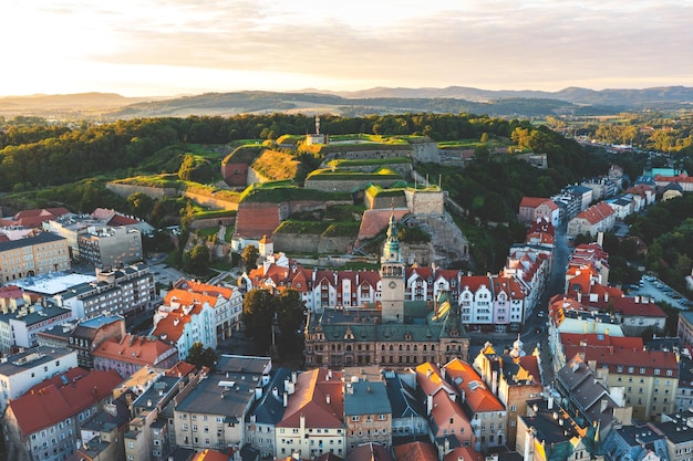 Panorama of the old town of Klodzko from above beautiful cityscape at sunset and red tiled roofs