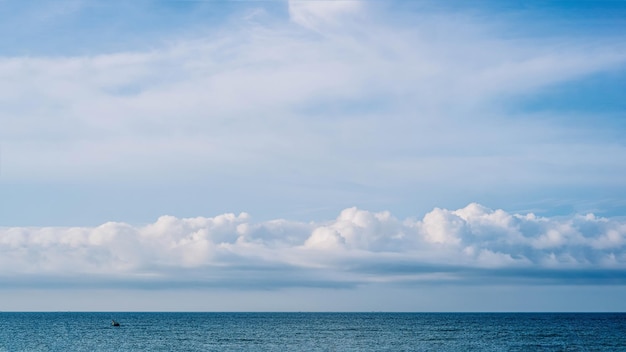 PANORAMA real photo natural cloudscape wallpaper Beautiful white fluffy cumulus clouds summer blue sky calm sea horizon skyline Concept relax mood more size and tone collection in stock