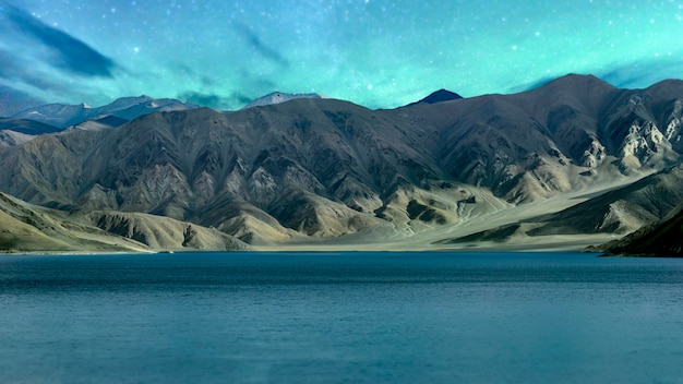 Panorama of Starry night in Norther part of India nature and landscape view in Pangong lake Leh ladakh india