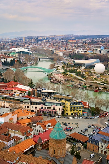 Panorama of Tbilisi from above. Old town center. The Kura River. Tbilisi, Georgia - 03.16.2021