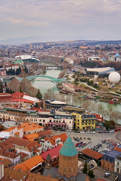 Panorama of Tbilisi from above. Old town center. The Kura River.