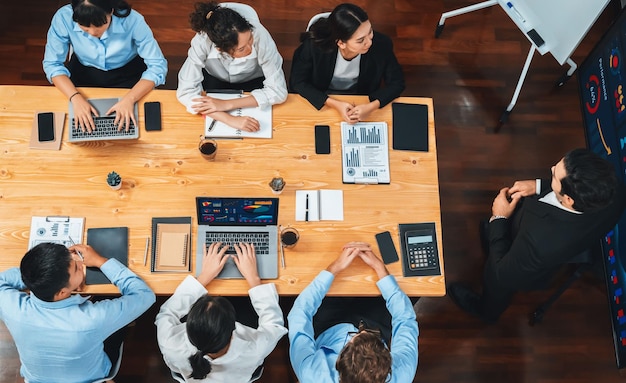 Panorama top view diverse analyst team analyzing financial data Meticulous