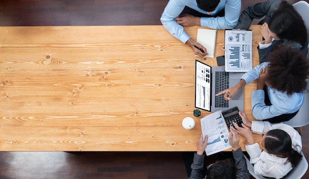 Panorama top view multiracial analyst team use BI dashboard display on laptop screen analyzing financial data for strategic decision Fintech analyzes marketing indicators Concord