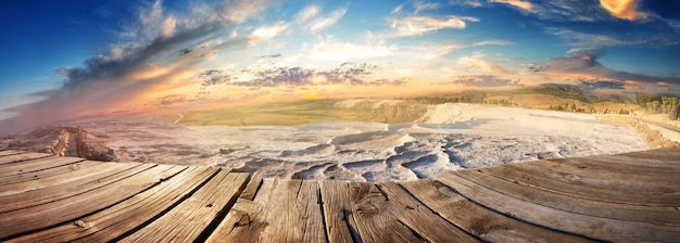 Panorama of the travertine terraces in Pamukkale at sunset