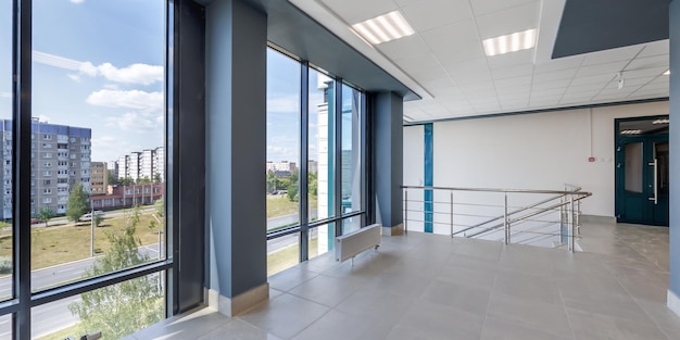 panorama view in empty modern hall with columns doors and panoramic windows