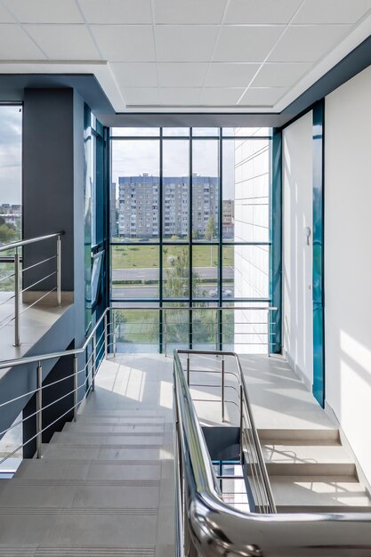 Panorama view in empty modern hall with columns doors and panoramic windows