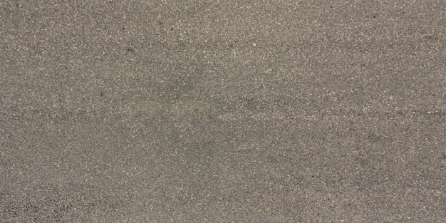 Panorama view from above on surface texture of old asphalt road with cracks