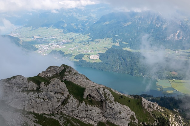 Panorama view of Lucerne lake and mountains scene in Pilatus of Lucerne, Switzerland, Europe. Summer landscape, sunshine weather, dramatic blue sky and sunny day