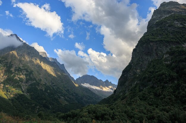 Panorama view on mountains scene in national park of Dombay, Caucasus, Russia. Summer landscape, sunshine weather and sunny day