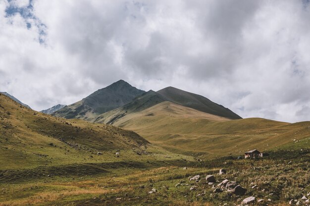 Panorama view of mountains scenes in national park Dombay, Caucasus, Russia, Europe. Dramatic blue sky and sunny summer landscape