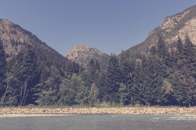 Panorama view of river scene in mountains of national park Dombay, Caucasus, Russia, Europe. , Dramatic blue sky and sunny summer landscape