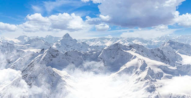 Panorama of winter mountains with blue sky in Caucasus regionElbrus mountain Russia