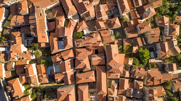 Panoramic aerial view of the red tiled roofs of the old town of Kotor and Kotor Bay