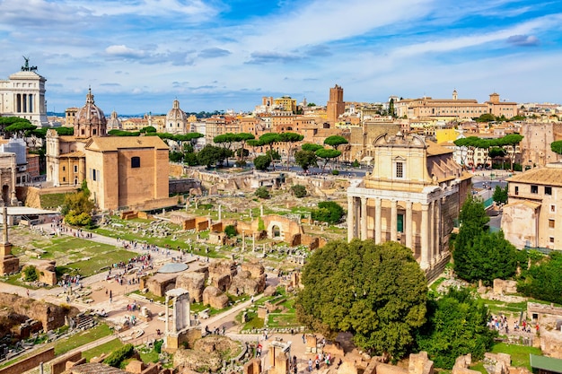 Panoramic cityscape view of the Roman Forum and Roman Altar of the Fatherland in Rome, Italy. World famous landmarks in Italy during summer sunny day.