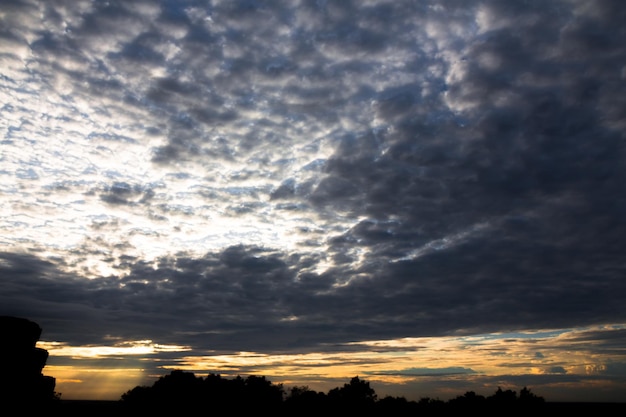 Panoramic cloudscape with the sun rays radiating from behind the cloudPhnom Bakheng sunset view Angkor Wat Siem Reap Cambodia