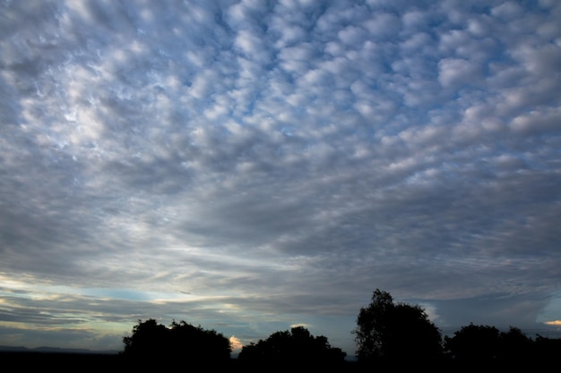 Panoramic cloudscape with the sun rays radiating from behind the cloudPhnom Bakheng sunset view Angkor Wat Siem Reap Cambodia