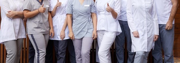 Panoramic cropped view of group of standing in a raw doctors