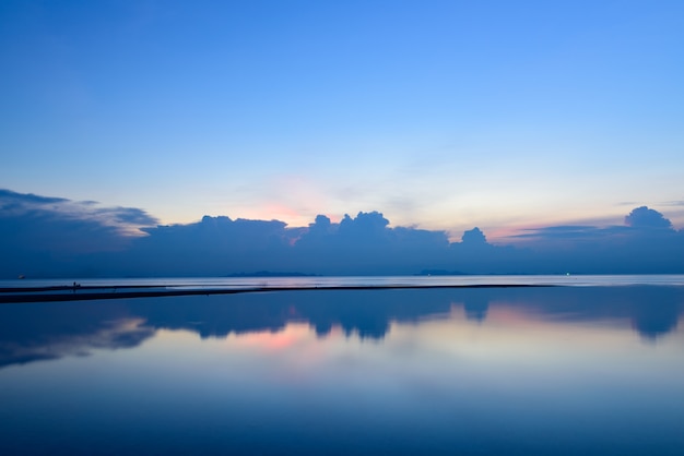 Panoramic dramatic tropical sunset sky and sea at dusk, long exposure