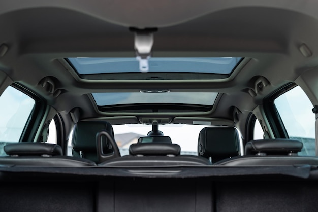 Panoramic glass sun roof in the modern car clean sunroof and view at the sky from the inside or car