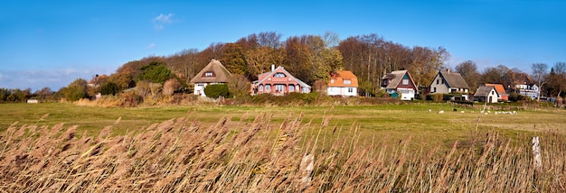 Panoramic image with traditional houses in Kloster, Hiddensee island, Baltic coast of Northern Germany