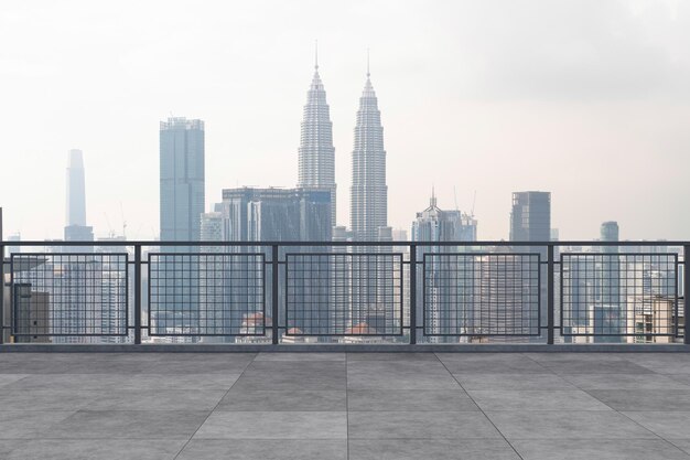 Panoramic Kuala Lumpur skyline view concrete observatory deck on rooftop daytime Asian corporate