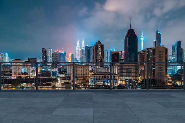 Panoramic Kuala Lumpur skyline view concrete observatory deck on rooftop night Asian corporate and residential lifestyle Financial city downtown real estate Product display mockup empty roof