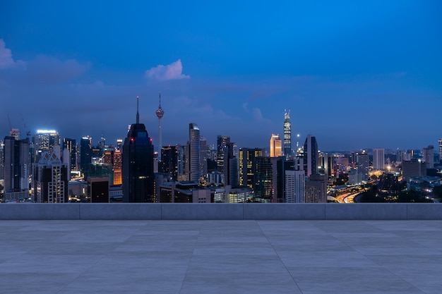 Panoramic Kuala Lumpur skyline view concrete observatory deck on rooftop night Asian corporate and residential lifestyle Financial city downtown real estate Product display mockup empty roof