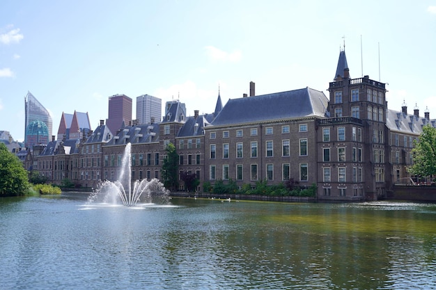 Panoramic landscape view with Binnenhof parliament building on Hofvijver pond The Hague The Netherlands