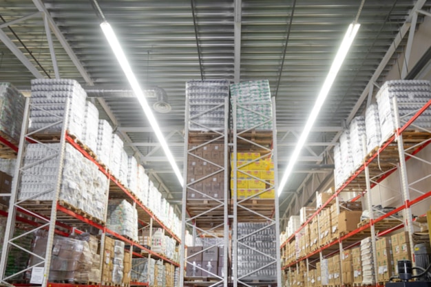 Panoramic photo of an automated warehouse logistics center with highbay shelving blurred photography