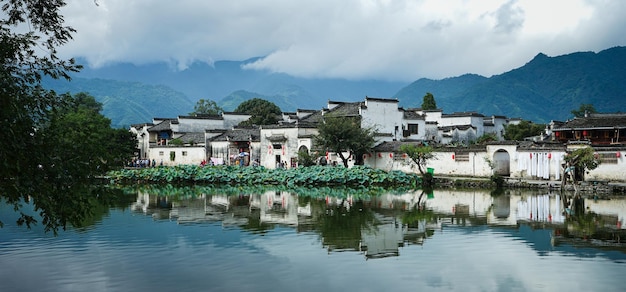 Panoramic shot of Hongcun ancient village in Yixian China reflected in the water