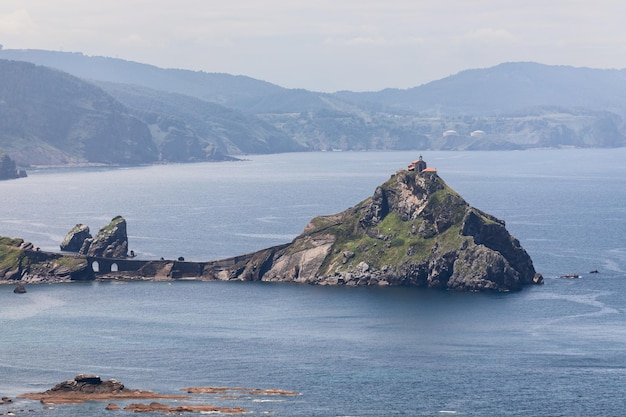 Panoramic shot of rocky island of Gaztelugatxe chapel on top Basque coastline Bermeo Spain