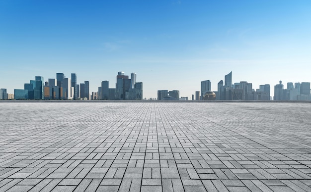 Panoramic skyline and buildings with empty concrete square floor