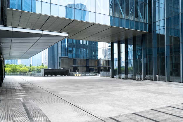 Panoramic skyline and buildings with empty concrete square floor