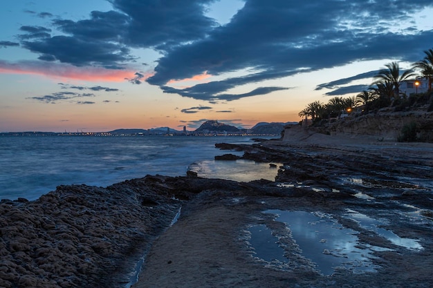 Panoramic view in the blue hour of the city of Alicante from Cabo de las Huertas Spain