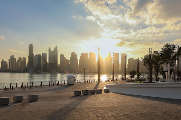 Panoramic view of Business Bay district with reflection in sea in morning Aerial sky at highest buildings in central Dubai United Arab Emirates