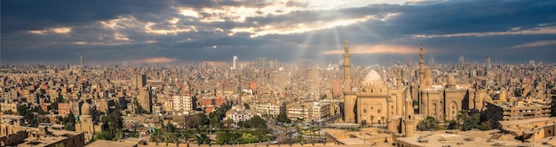 Panoramic view of Cairo and sunbeams over Sultan Hassan Mosque