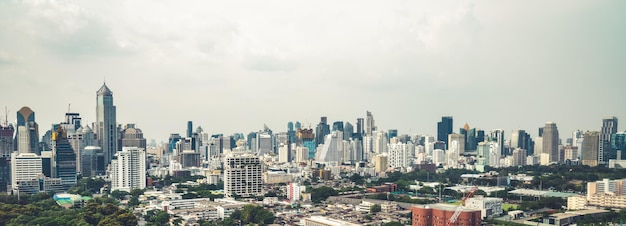 Panoramic view of cityscape and construction site in metropolis