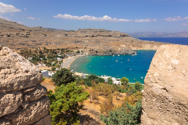 Panoramic view of colorful harbor in Lindos village Rhodes Aerial view of beautiful landscape sea