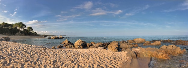 Panoramic view on a Corsica beach with rock in the sea summer vacation